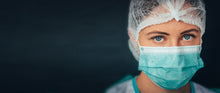Model wearing a blue disposable 3-ply face mask